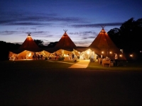 Tepee tent by night at Smedmore House
