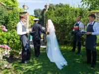 Bride and Groom entering garden