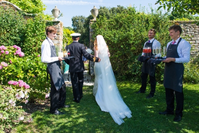 Bride and Groom entering garden